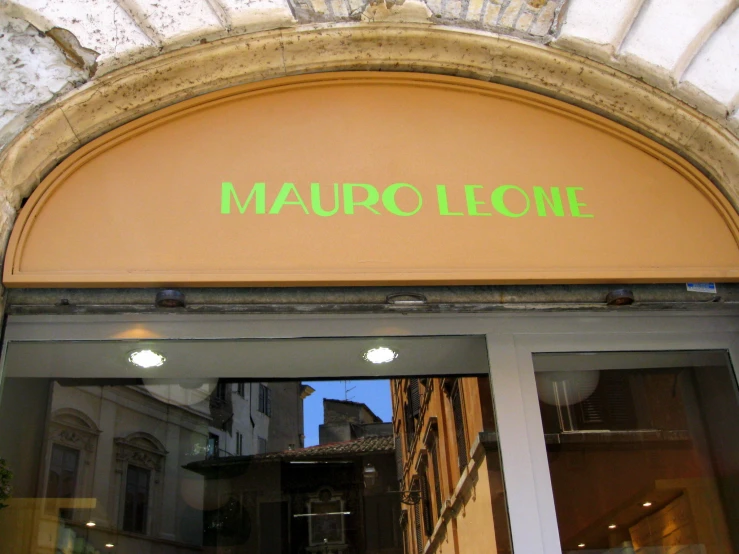 the word maupelloch above a store window in a town
