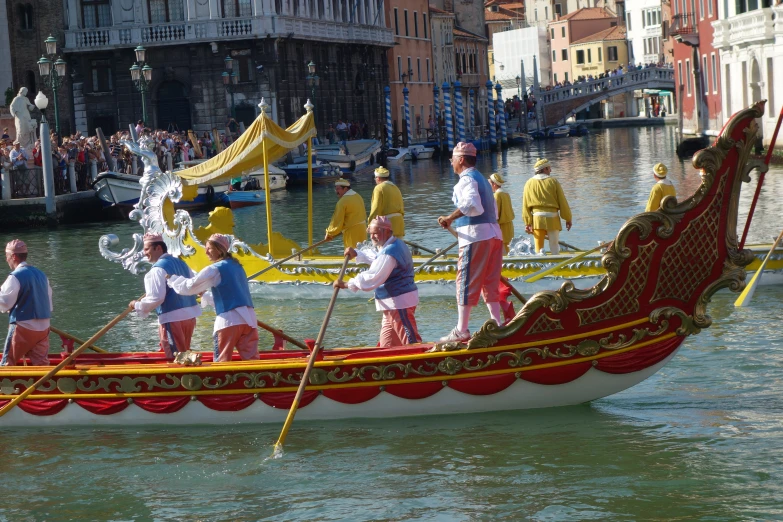 people riding on top of a boat in a body of water