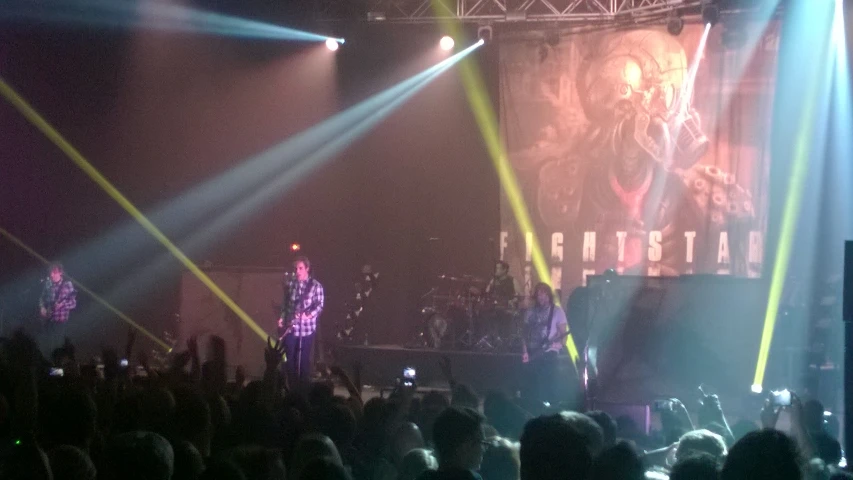 the crowd is watching the concert on stage