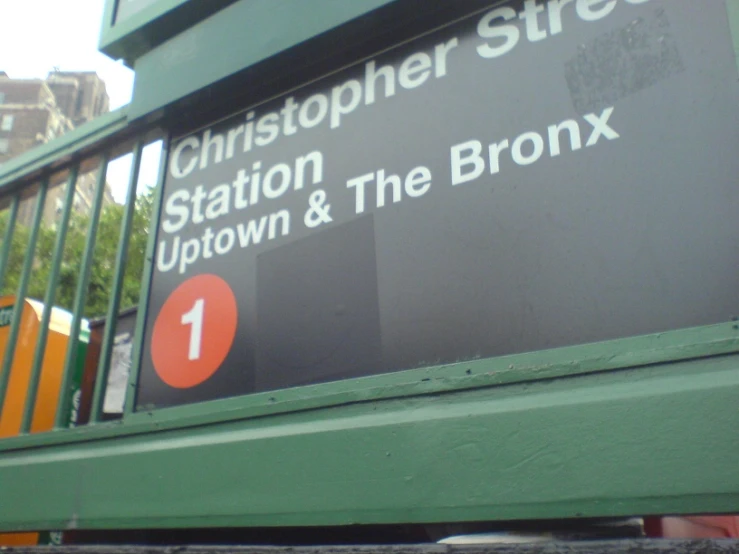 the station sign is located at the front of the station