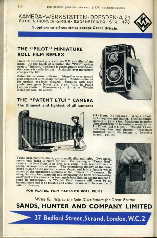 a booklet describing an old camera being held by a person