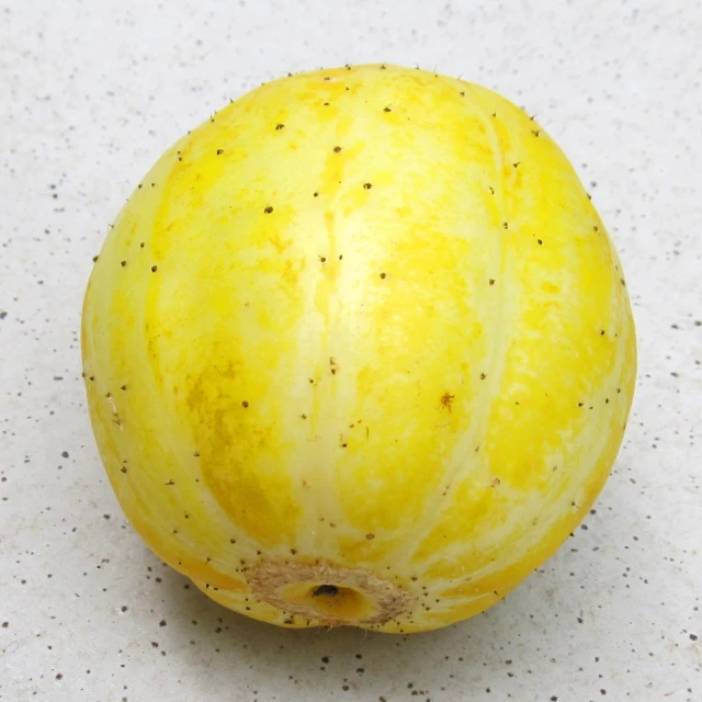 a close up view of a yellow fruit