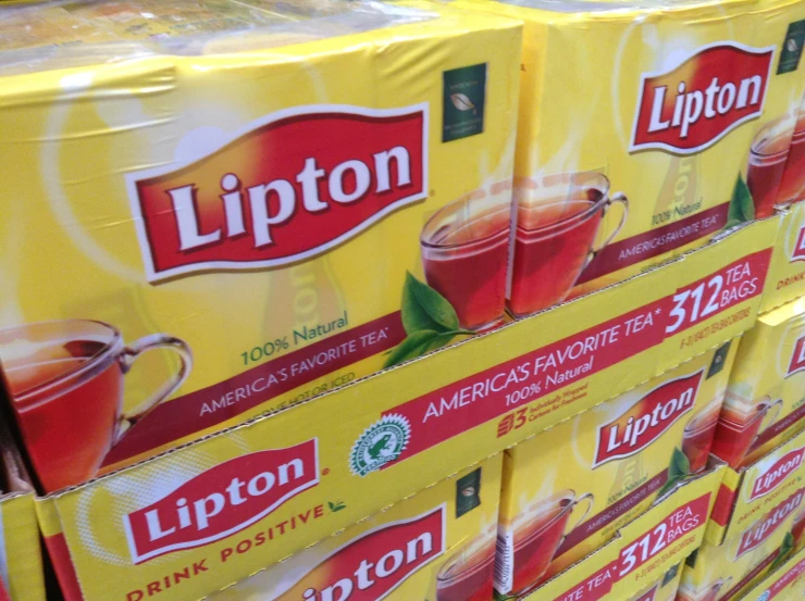 a large stack of lipton coffee cups on display