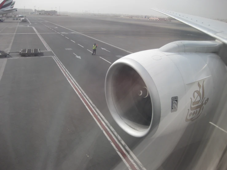 an airplane engine and wing is seen from the air