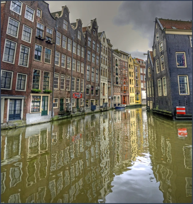 some houses in the water and a few buildings