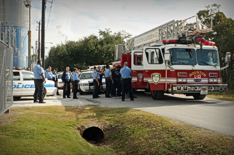 fire engine with crew members near a curb