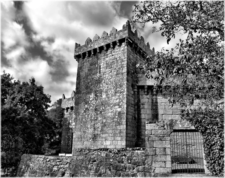 a brick castle that is built on a hill