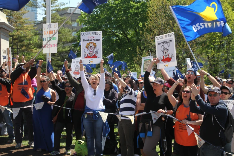 several people protesting on a street during a demonstration