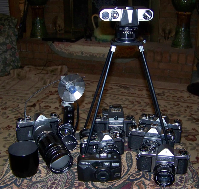 a group of cameras sitting on top of a table