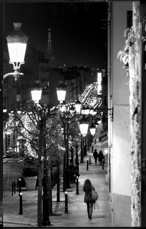 a person walks down a sidewalk in the city