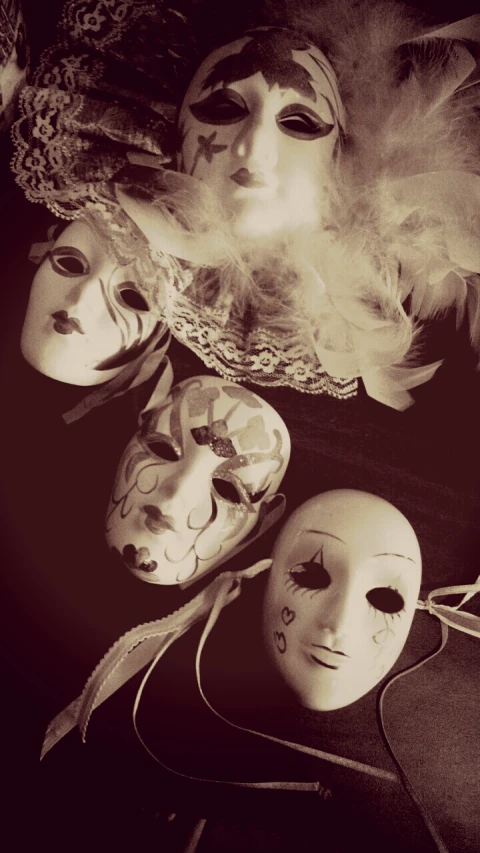 a black and white image with several masks