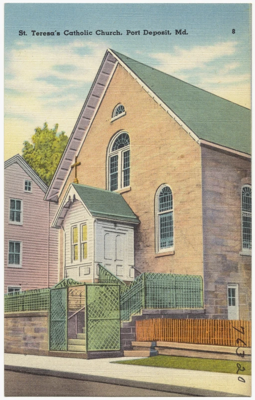 old church with a green gate on the sidewalk