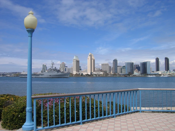 a blue post in front of a large body of water