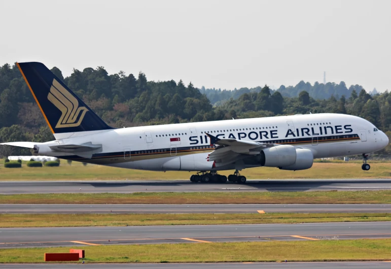 a singapore airlines plane on an airport runway