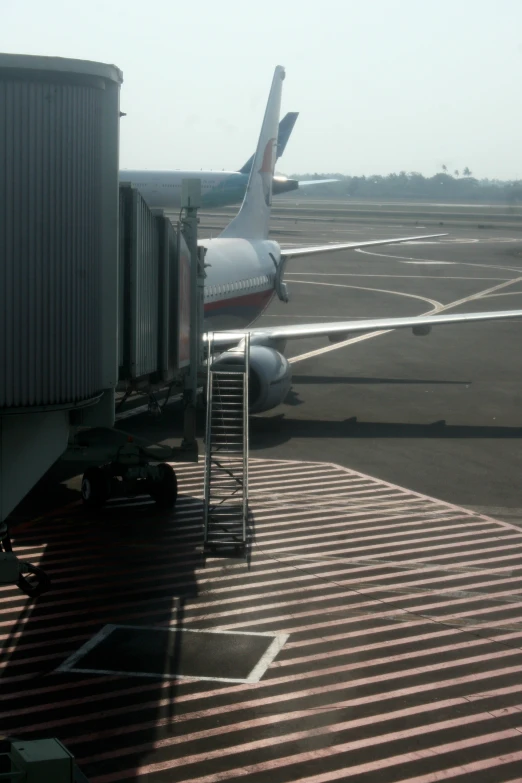 there is an airplane parked at the gate