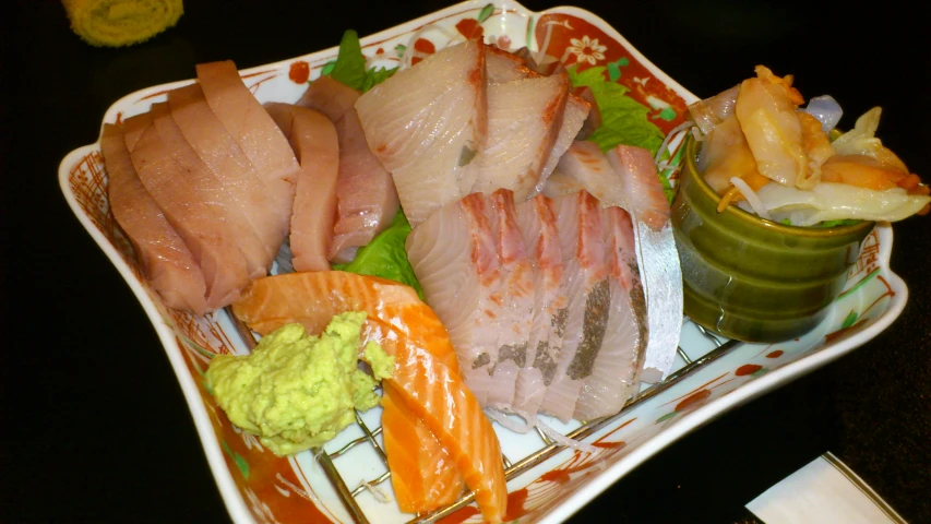 an assortment of meats and vegetables on a tray