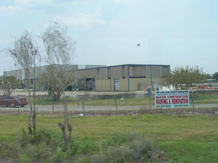 an empty building on the side of the road