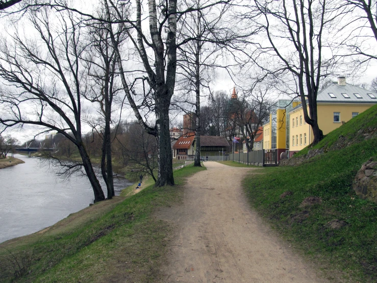 an image of the road going down to a village