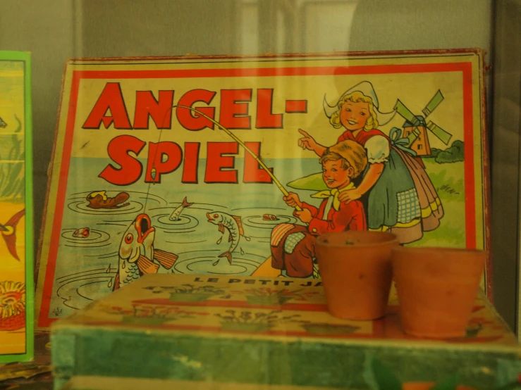 an antique ad is displayed on a wall in a store window