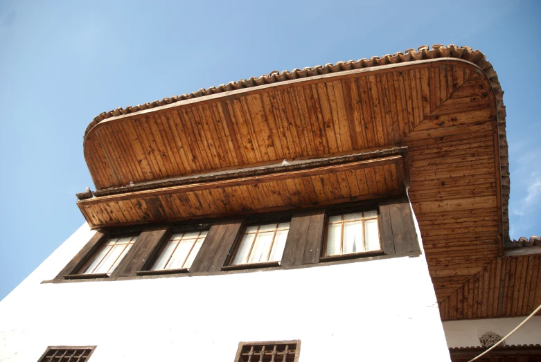 a building is covered in bamboo blinds with window frames