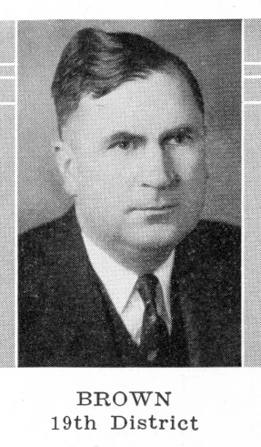 a newspaper clipping of a man in a suit and tie