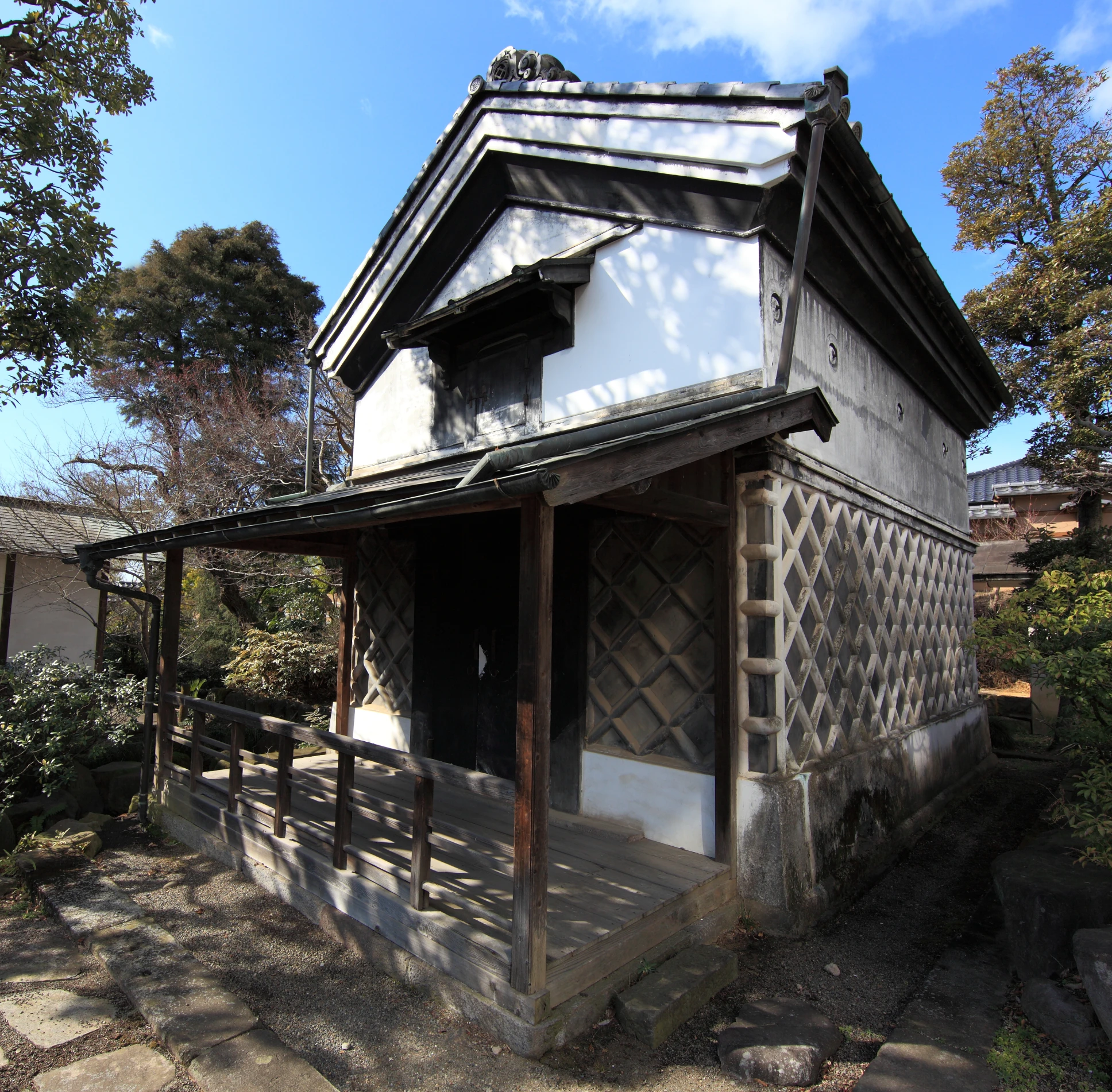 the building has an oriental roof and is made of wood