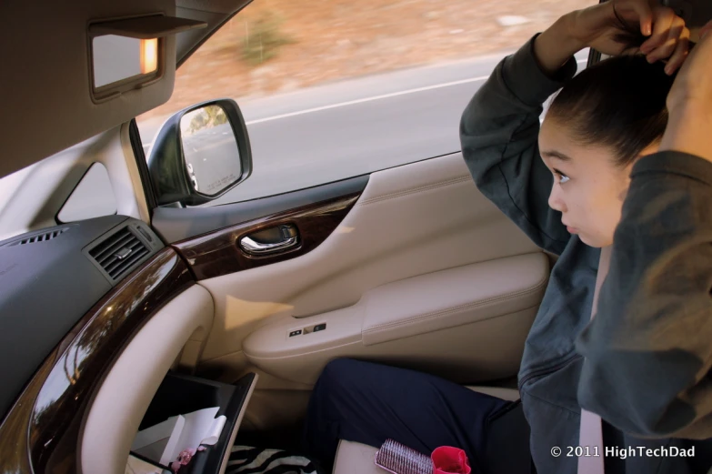 a person inside of a car sitting on the driver's seat