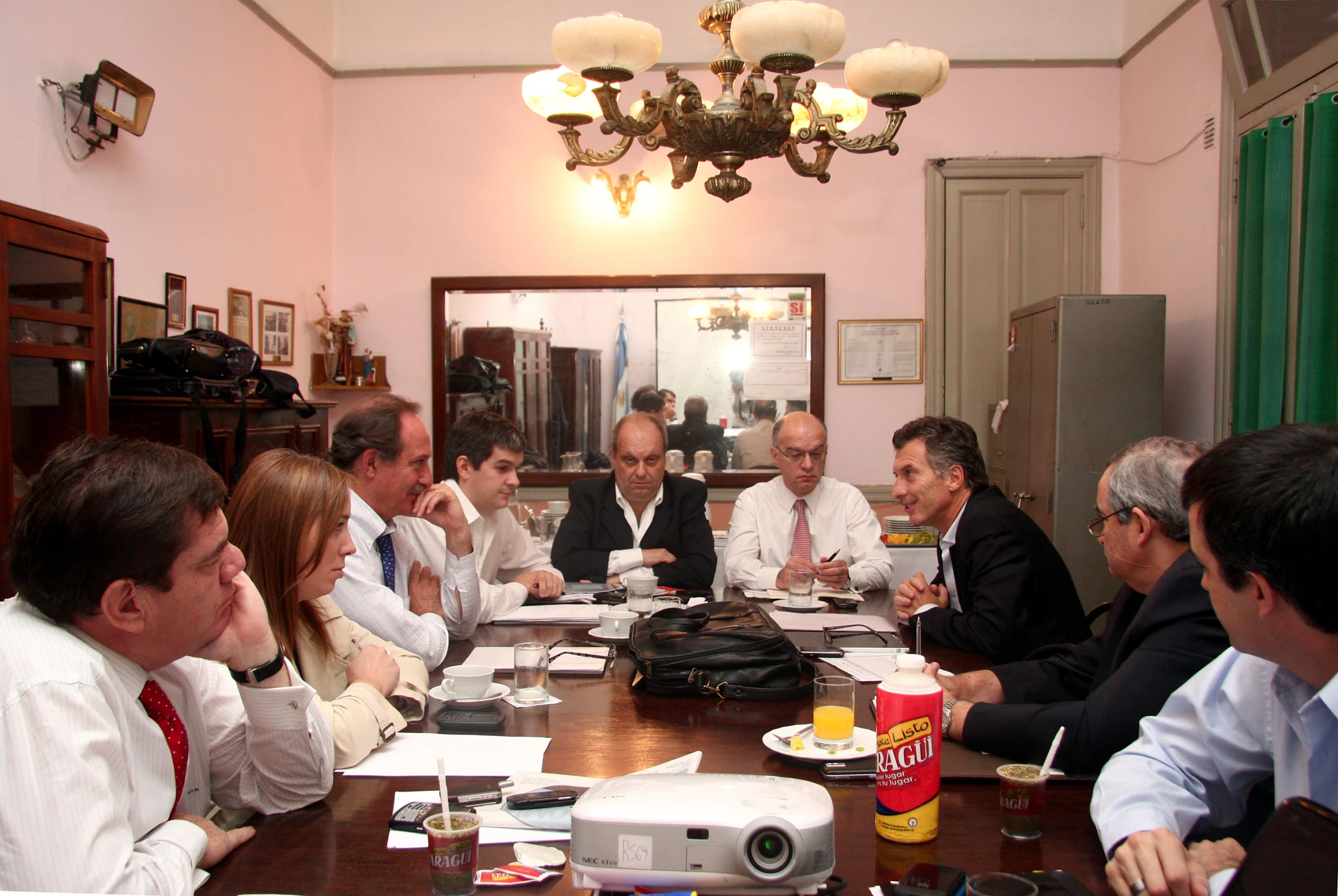 a bunch of people gathered around a table