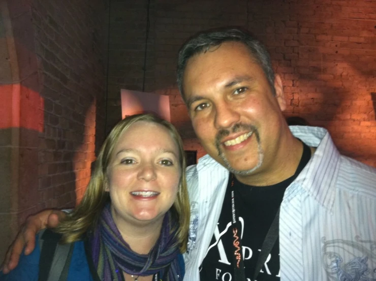 a man and a woman posing for a picture together