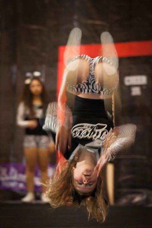 a  doing a handstand in the air