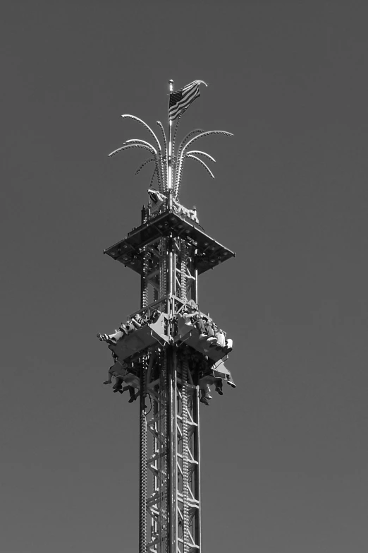 a tall tower with lots of small metal structures
