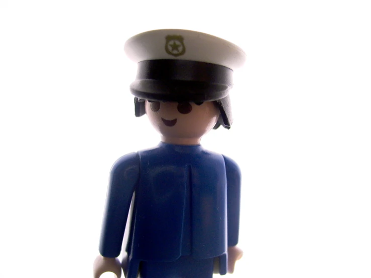 a toy man with a sailor hat and sailor dress