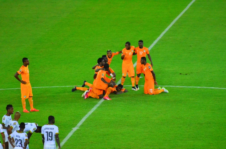 a group of soccer players celeting during a game