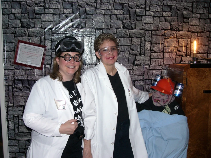 a man and woman in white lab coats stand next to each other