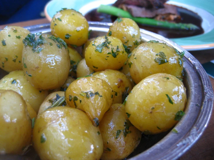 several small objects are sitting in a silver bowl