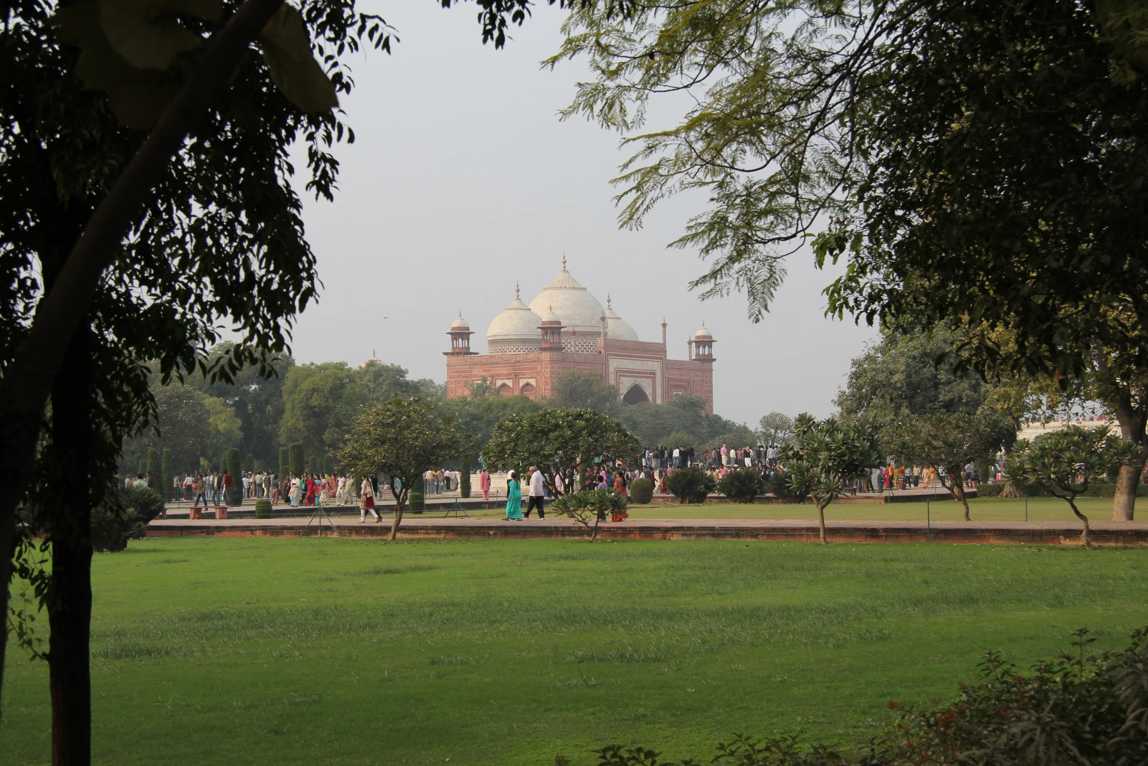 people walking in front of a large palace