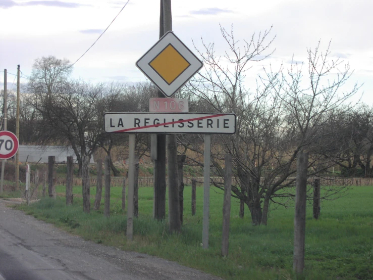 a road sign by a small country lane