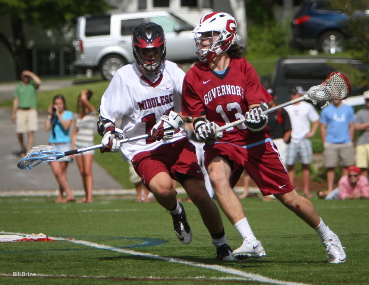 two men with white and red uniforms on the field