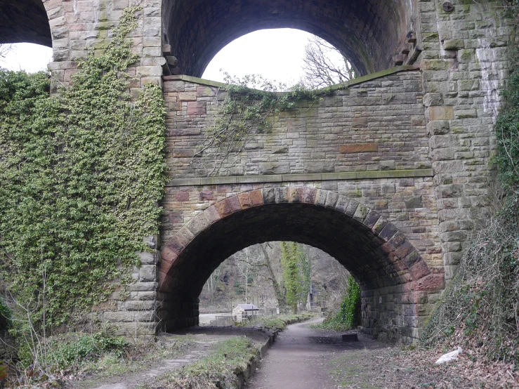 an arch bridge that leads to another arched bridge