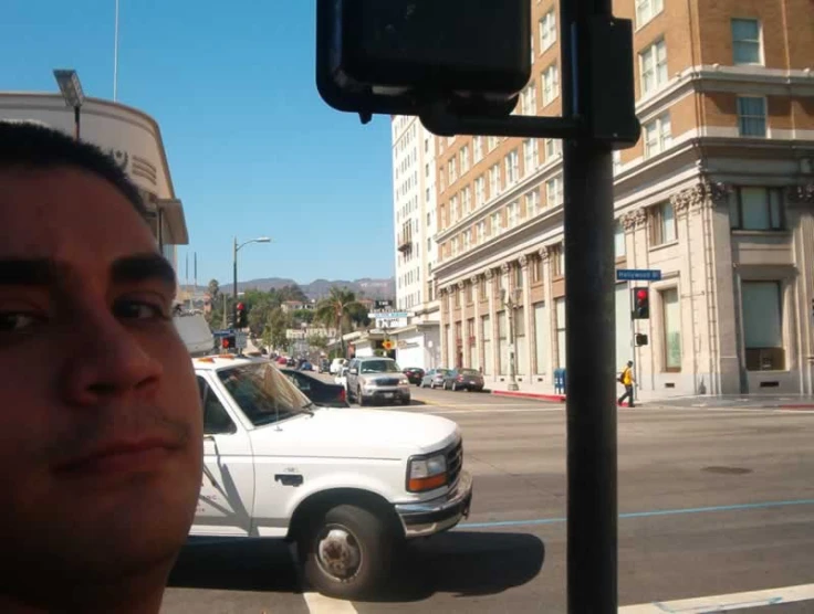 a person standing next to a busy street