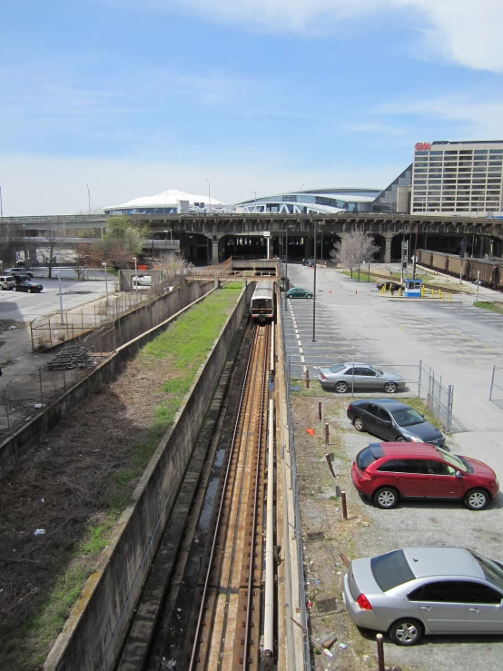 an outdoor parking lot with cars parked beside each other