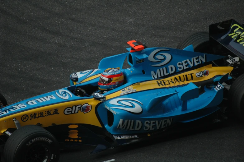 a race car moving down the track in a motion