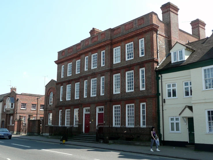 a large building with tall windows on the side