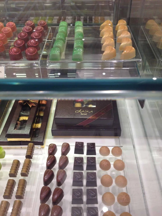 chocolate items in different colors and shapes on display