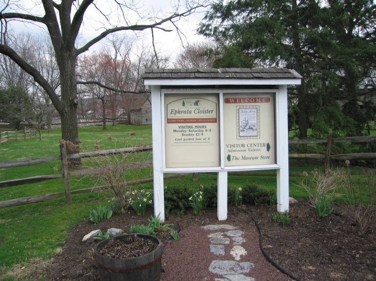 sign showing information and landscaping for garden center