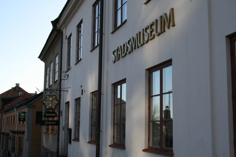 a sign that is above the windows of a building