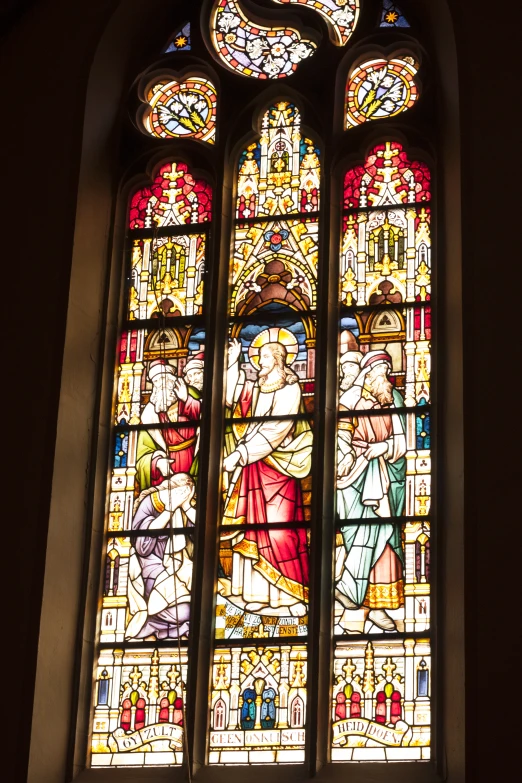 an elaborate stain glass window in a church