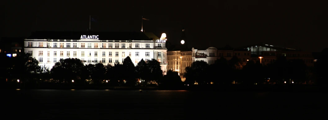 a very large building that has some lights in front of it