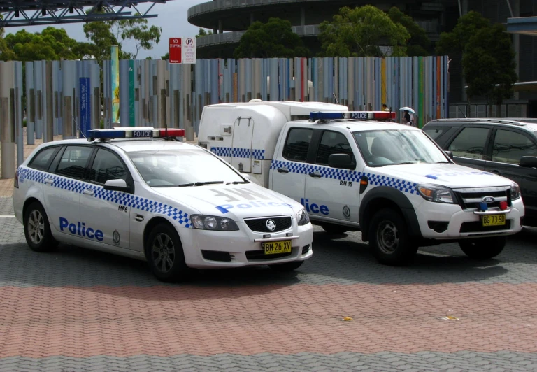 two police cars that are sitting in the street