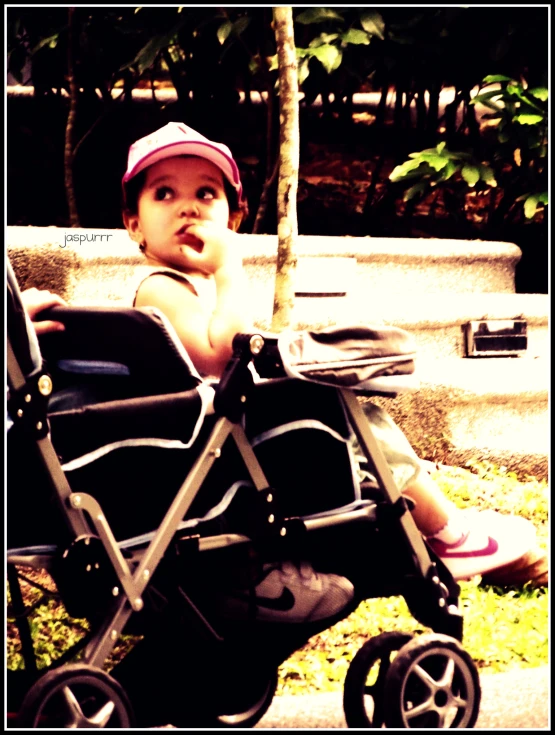 little girl looking at camera in outdoor setting